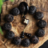 Ebony Wood Yin Yang Gourd Balance Bracelet - carved yin-yang beads with swastika pendant and gourd charm on bark surface, wooden mala bracelet