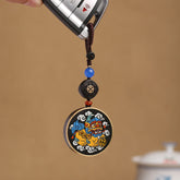 PiXiu Coin Keychain – Colorful PiXiu medallion on car key with blue bead and ebony accent