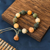 Bodhi Seed Moss Agate Lotus Peace Bracelet - carved beads on wood with navy silk, calm