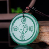 Green Aventurine Yin Yang Balance Necklace Pendant – carved yin-yang disc on dark cord, green aventurine