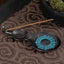 Gourd Yin Yang Bagua Incense Burner – Black gourd with turquoise Bagua and incense on fabric, copper burner