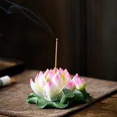 Lotus Ceramic Incense Burner - pink lotus bloom with seed pod on green leaf, smoke rising, ceramic incense holder