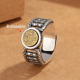 Om Mani Padme Hum Copper Ring – Rotatable gold coin center on dark wood, rotatable ring