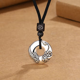 PiXiu Peace Buckle Copper Wealth Necklace – Silver peace buckle with PiXiu carving on black cord, prosperity jewelry