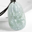 Zodiac Buddha Jade Necklace – front closeup of seated Buddha jade pendant, white studio background, protection amulet