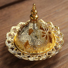 Mini Alloy Incense Burner – disassembled gold dome lid beside base with cone incense on black pad