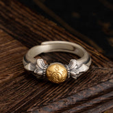 Manjusri Mantra Ring – Adjustable silver band with gold mantra bead on dark wood, sterling silver Buddhist ring