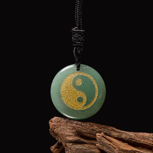 Yin Yang Crystal Necklace – Green aventurine round pendant with gold yin-yang symbol, polished jade stone on black braided co