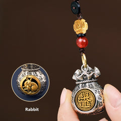 Gira la fortuna: 12 llaveros del zodiaco con bolsas de riqueza giratorias