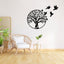 Tree of Life Birds Metal Wall Art - black tree with flying birds on white wall in boho living room with plants