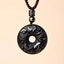 Black Obsidian Necklace – dragon zodiac disc with clouds, brown cord obsidian amulet
