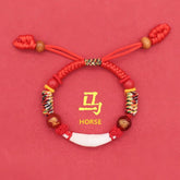 Kids Zodiac Bracelet – horse zodiac variant, adjustable red cords with wooden toggles, lucky gift
