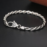 Silver Rope Chain Bracelet – twisted wheat chain with crystal clasp on dark surface, sterling silver bracelet