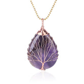 Quartz Crystal Tree of Life Necklace – amethyst pendant with reflection, rose gold wire, white background