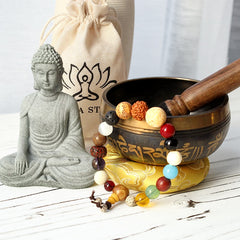 Tibetan Singing Bowl Gift Set – Arranged on white wood with Buddha statue, mala beads and cushion