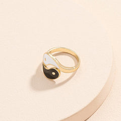 Yin Yang Adjustable Couple Ring - three-quarter view of gold black white enamel taijitu design, bohemian jewelry