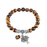 Tree of Life tiger eye bracelet with golden-brown banded gemstone beads, silver tree-of-life charm, ornate silver spacers, matching tiger eye dangle.