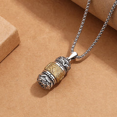 Om Mani Padme Hum Pendant – Angled view showing cylindrical prayer wheel and silver chain on kraft paper, men necklace