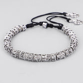 Tibetan Mantra Purity Bracelet – Adjustable black cord with engraved silver beads and vajra charms, Tibetan jewelry