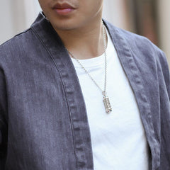 Om Mani Padme Hum Silver Necklace - Worn by model, silver Tibetan mantra pendant on chest, men's jewelry
