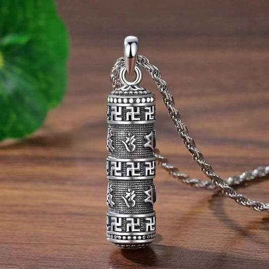 Copper Om Mani Padme Hum Necklace – Three-quarter view of engraved cylindrical prayer wheel pendant with swastika and mantra bands on twisted chain, Tibetan Buddhist jewelry