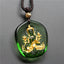 Green Tara Buddha Gold Plated Liuli Crystal Pendant – front view with gold relief details on deep green crystal, front detail
