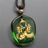 Green Tara Buddha Gold Plated Liuli Crystal Pendant – front view with gold relief details on deep green crystal, front detail