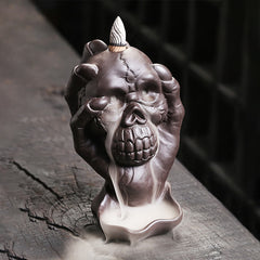 Skull Ghost Hand Burner – single hand clutching skull with cascading smoke, purple clay decor