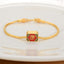 18K Gold Om Mani Padme Hum Koi Fish Bracelet – square gold bead with red Fu character and black cloud enamel, braided chain, white dish