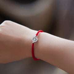 925 Sterling Silver Yin Yang Bagua Cinnabar Bracelet – Worn on wrist showing silver Bagua charm, red cord, bokeh background