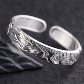 Sterling Silver Dragon Bangle – Detailed dragon head with gold horn inlay on dark stone, Protection