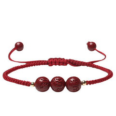 Cinnabar Om Mani Padme Hum Braided Bracelet – Flat lay on white with adjustable knot, red bead bracelet