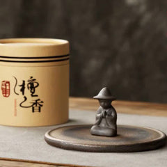 Sandalwood incense set with monk figure and ceramic base, mindful