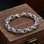 Tibetan Om Mani Padme Hum Copper Bracelet – carved silver links on antique wooden chest, vintage jewelry