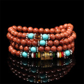 Goldstone Mala Bracelet – coiled multi-strand goldstone beads with turquoise on black, prayer jewelry