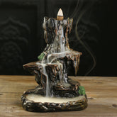 Backflow Incense Burner – smoke waterfall cascading on wood table, serene