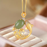 Cyan Jade Koi Fish Healing Necklace Pendant – front view of jade koi pendant on cord, calm luck jewelry