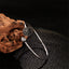 White Copper Lotus Enlightenment Bangle - open cuff on driftwood, lotus bloom, pure
