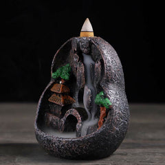 Resin Backflow Incense Burner – Round stone orb with pagoda, bridge and smoke flowing through archway, waterfall incense
