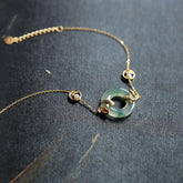 Cyan Jade Koi Fish Bracelet - full view showing translucent cyan jade beads with koi charm