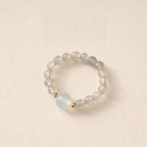 Moonstone Pi Xiu Ring – Labradorite bead ring with pale blue moonstone center and gold spacers, emotional balance jewelry