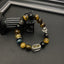 Tiger Eye Bracelet – Mixed gemstone beads with silver lion head on black column, wealth protection jewelry