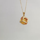 Gemstone Chip Pendant – Orange citrine raw crystal cube in gold rim on chain, gray background, boho necklace