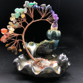 Crystal Tree Incense Burner – copper-wire tree with chakra crystals on lotus base, backflow smoke, black background, Feng Shui decor
