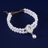 Luxury Pearl Pet Necklace – Double-layer pearl collar with clear crystal centerpiece and teardrop pendant, navy backdrop
