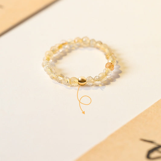 2mm Citrine Ring – Tiny faceted citrine beads with gold accent bead on cream paper, feng shui wealth jewelry