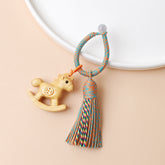 Rainbow Wooden Horse Keychain – natural wood horse with colorful tassel and braided rope ring