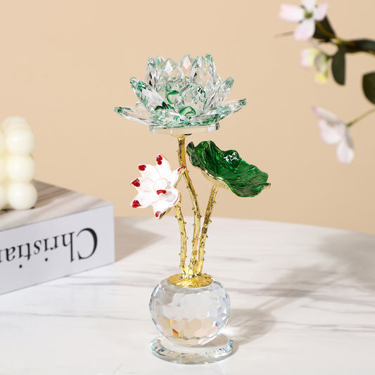 Crystal Lotus – green crystal lotus flower with gold stem and leaf on crystal ball base, beige lifestyle decor background