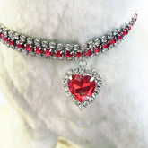 Heart Crystal Pet Collar – silver band ruby red crystals with dangling red heart pendant, fluffy white display