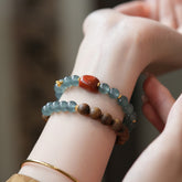 Blue Feicui Jade Two-Row Bracelet – wrist shot with blue jade, red agate, agarwood beads, gold spacers